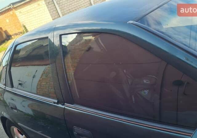 Серый Опель Астра, объемом двигателя 2 л и пробегом 178 тыс. км за 2550 $, фото 2 на Automoto.ua