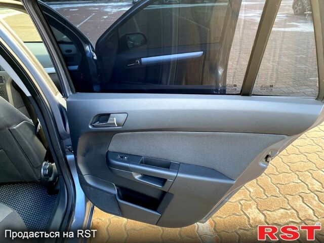 Серый Опель Астра, объемом двигателя 1.4 л и пробегом 243 тыс. км за 5200 $, фото 9 на Automoto.ua