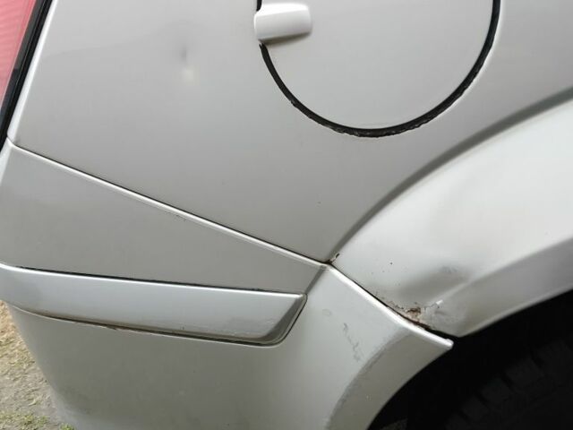 Серый Опель Астра, объемом двигателя 1.2 л и пробегом 306 тыс. км за 3600 $, фото 6 на Automoto.ua