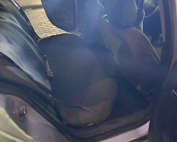 Серый Опель Астра, объемом двигателя 1.7 л и пробегом 238 тыс. км за 4999 $, фото 24 на Automoto.ua