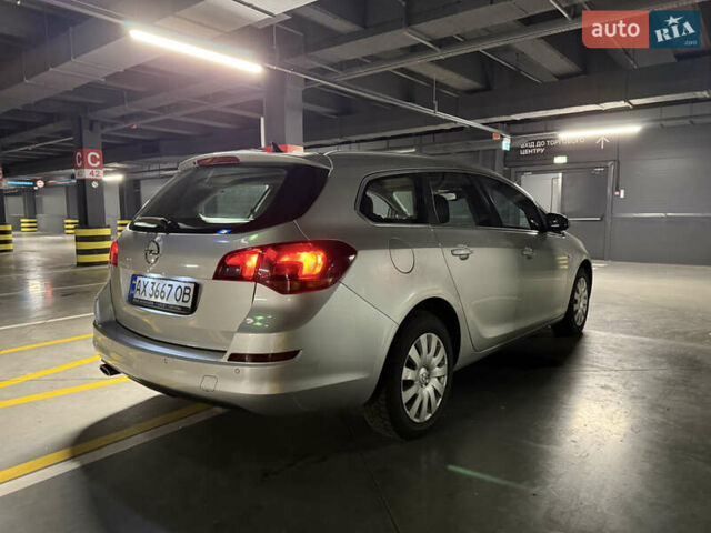 Серый Опель Астра, объемом двигателя 1.4 л и пробегом 243 тыс. км за 7800 $, фото 6 на Automoto.ua