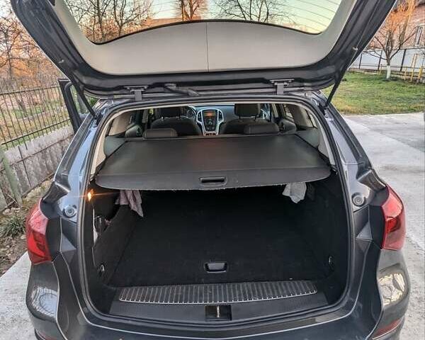 Серый Опель Астра, объемом двигателя 1.3 л и пробегом 264 тыс. км за 7300 $, фото 7 на Automoto.ua