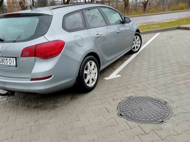 Серый Опель Астра, объемом двигателя 1.2 л и пробегом 254 тыс. км за 5000 $, фото 4 на Automoto.ua