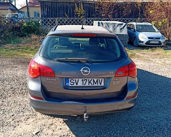 Серый Опель Астра, объемом двигателя 1.7 л и пробегом 236 тыс. км за 7000 $, фото 2 на Automoto.ua