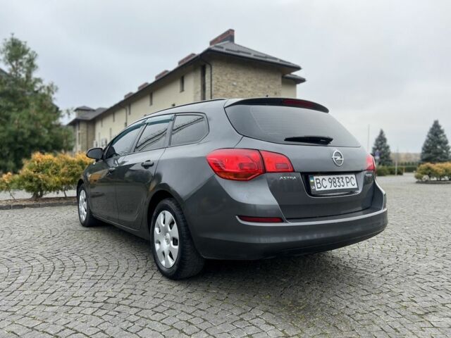 Серый Опель Астра, объемом двигателя 1.2 л и пробегом 264 тыс. км за 4750 $, фото 7 на Automoto.ua