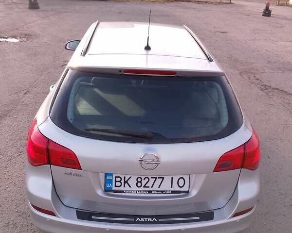 Серый Опель Астра, объемом двигателя 1.4 л и пробегом 183 тыс. км за 5700 $, фото 3 на Automoto.ua