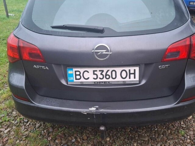 Серый Опель Астра, объемом двигателя 1.7 л и пробегом 317 тыс. км за 5900 $, фото 6 на Automoto.ua