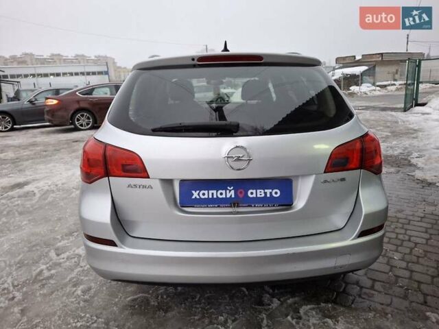 Серый Опель Астра, объемом двигателя 1.2 л и пробегом 245 тыс. км за 5600 $, фото 5 на Automoto.ua