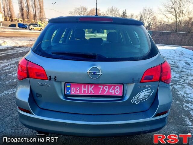 Сірий Опель Астра, об'ємом двигуна 1.4 л та пробігом 21000 тис. км за 7350 $, фото 5 на Automoto.ua