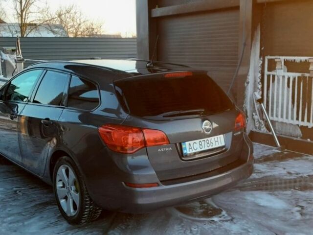 Серый Опель Астра, объемом двигателя 1.2 л и пробегом 261 тыс. км за 6500 $, фото 6 на Automoto.ua