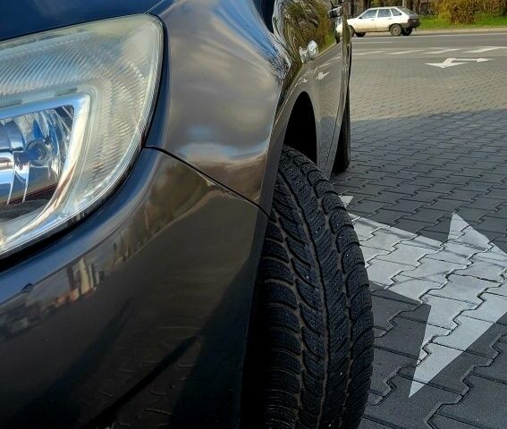 Серый Опель Астра, объемом двигателя 1.4 л и пробегом 249 тыс. км за 7300 $, фото 2 на Automoto.ua