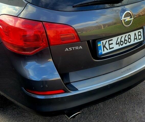 Серый Опель Астра, объемом двигателя 1.4 л и пробегом 249 тыс. км за 7300 $, фото 11 на Automoto.ua
