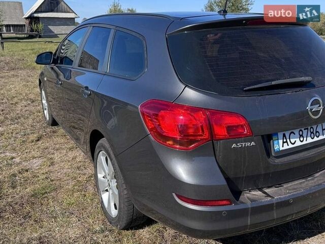 Серый Опель Астра, объемом двигателя 1.3 л и пробегом 263 тыс. км за 5900 $, фото 4 на Automoto.ua