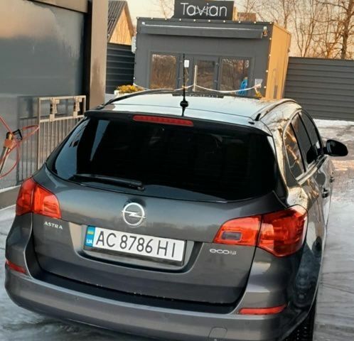 Серый Опель Астра, объемом двигателя 1.2 л и пробегом 261 тыс. км за 6500 $, фото 8 на Automoto.ua
