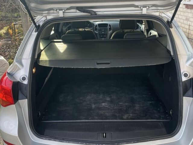 Серый Опель Астра, объемом двигателя 1.2 л и пробегом 230 тыс. км за 5600 $, фото 7 на Automoto.ua