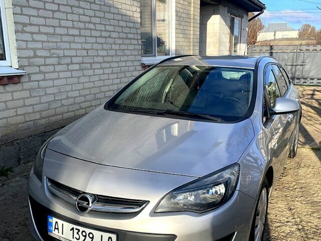 Серый Опель Астра, объемом двигателя 1.2 л и пробегом 230 тыс. км за 5600 $, фото 1 на Automoto.ua