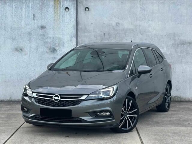 Серый Опель Астра, объемом двигателя 1.4 л и пробегом 39 тыс. км за 12450 $, фото 2 на Automoto.ua