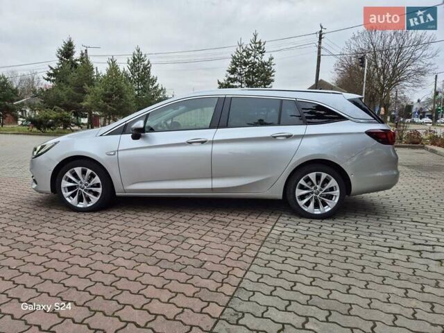 Сірий Опель Астра, об'ємом двигуна 1.5 л та пробігом 142 тис. км за 13700 $, фото 1 на Automoto.ua