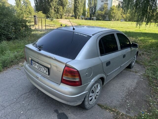 Серый Опель Астра, объемом двигателя 2 л и пробегом 230 тыс. км за 1555 $, фото 3 на Automoto.ua