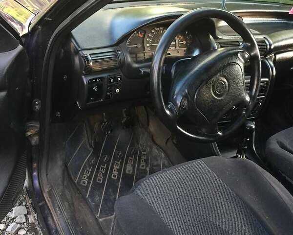 Синий Опель Астра, объемом двигателя 1.6 л и пробегом 380 тыс. км за 1314 $, фото 2 на Automoto.ua