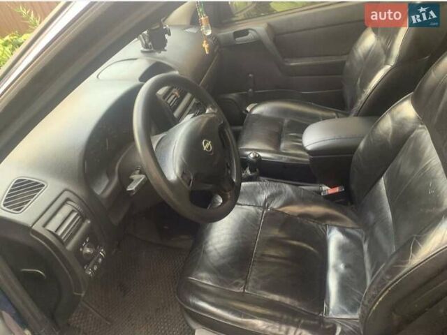 Синий Опель Астра, объемом двигателя 1.6 л и пробегом 270 тыс. км за 1650 $, фото 6 на Automoto.ua