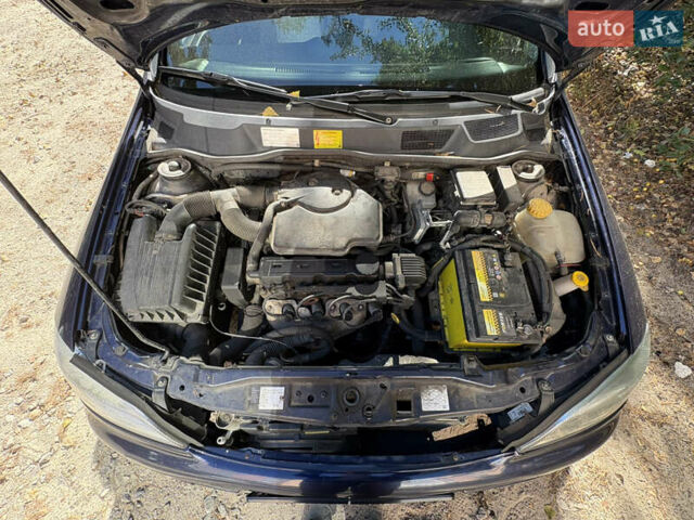 Синий Опель Астра, объемом двигателя 1.6 л и пробегом 205 тыс. км за 3000 $, фото 5 на Automoto.ua