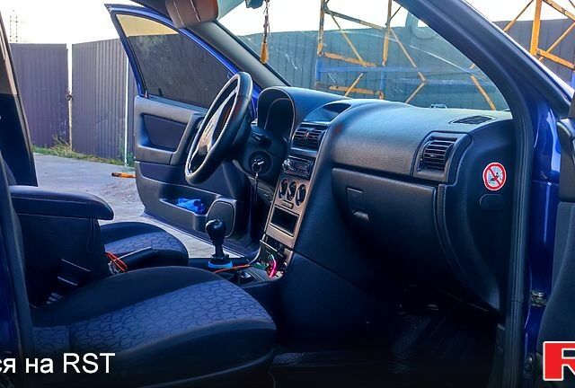 Синий Опель Астра, объемом двигателя 2 л и пробегом 330 тыс. км за 3550 $, фото 9 на Automoto.ua