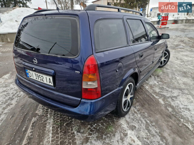 Синий Опель Астра, объемом двигателя 1.7 л и пробегом 305 тыс. км за 3000 $, фото 11 на Automoto.ua