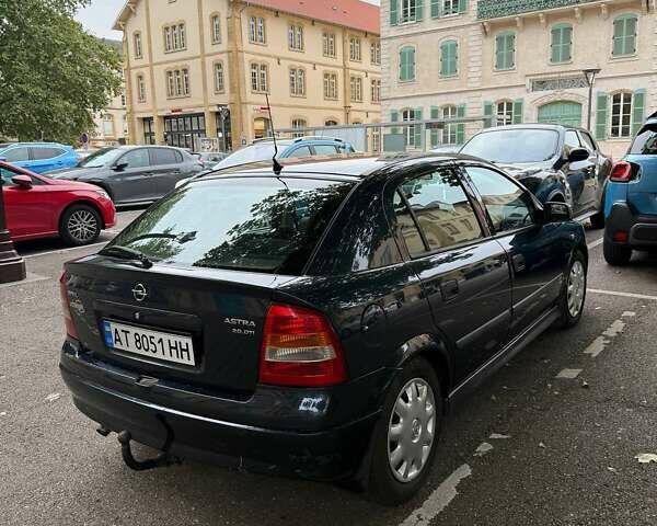 Синий Опель Астра, объемом двигателя 2 л и пробегом 230 тыс. км за 4731 $, фото 6 на Automoto.ua