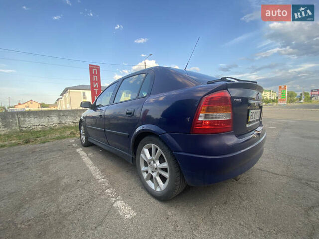 Синий Опель Астра, объемом двигателя 1.2 л и пробегом 264 тыс. км за 2800 $, фото 15 на Automoto.ua