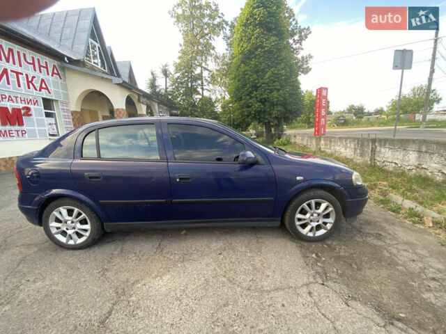 Синий Опель Астра, объемом двигателя 1.2 л и пробегом 264 тыс. км за 2800 $, фото 8 на Automoto.ua