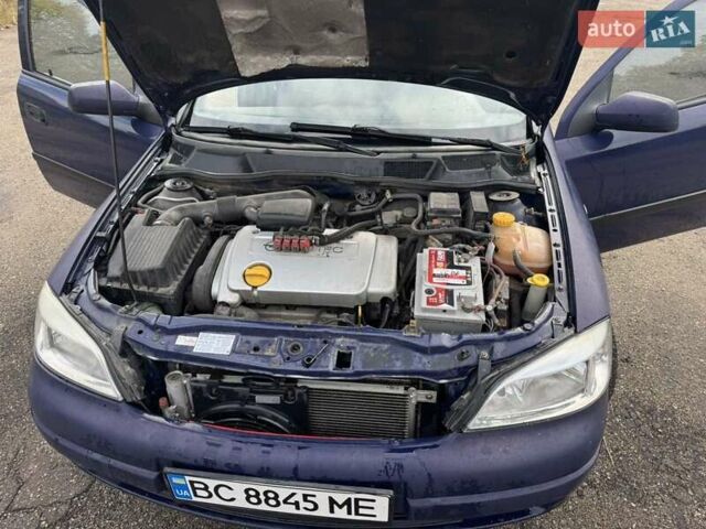 Синий Опель Астра, объемом двигателя 1.39 л и пробегом 320 тыс. км за 2300 $, фото 2 на Automoto.ua