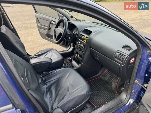 Синий Опель Астра, объемом двигателя 1.39 л и пробегом 320 тыс. км за 2300 $, фото 4 на Automoto.ua