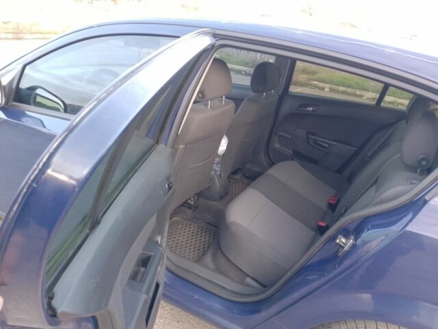 Синий Опель Астра, объемом двигателя 1.7 л и пробегом 330 тыс. км за 3750 $, фото 4 на Automoto.ua