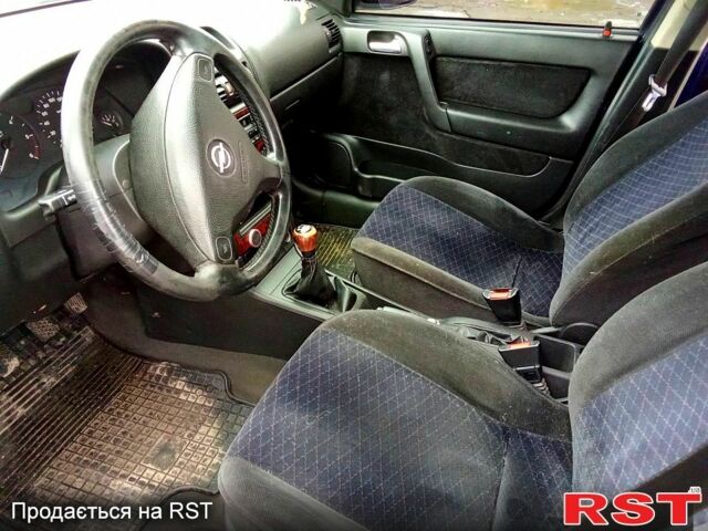 Синий Опель Астра, объемом двигателя 2 л и пробегом 220 тыс. км за 3250 $, фото 7 на Automoto.ua