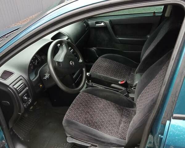 Синий Опель Астра, объемом двигателя 1.6 л и пробегом 209 тыс. км за 2700 $, фото 4 на Automoto.ua