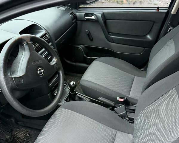 Синий Опель Астра, объемом двигателя 1.39 л и пробегом 210 тыс. км за 3299 $, фото 17 на Automoto.ua