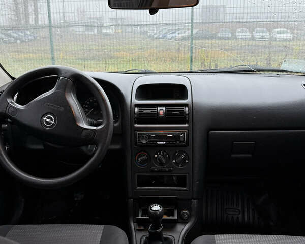 Синий Опель Астра, объемом двигателя 1.39 л и пробегом 210 тыс. км за 3299 $, фото 20 на Automoto.ua