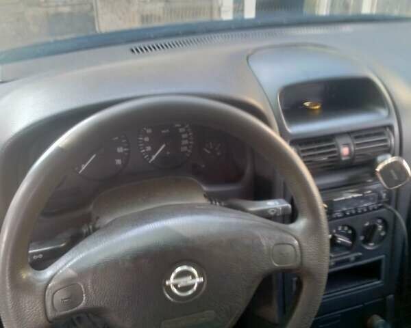 Синий Опель Астра, объемом двигателя 1.4 л и пробегом 180 тыс. км за 3200 $, фото 6 на Automoto.ua