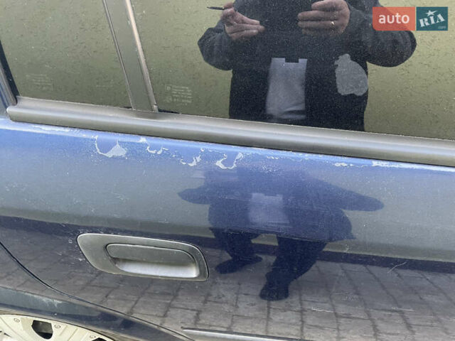 Синий Опель Астра, объемом двигателя 1.39 л и пробегом 330 тыс. км за 3100 $, фото 6 на Automoto.ua