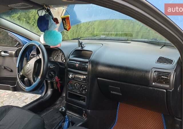 Синій Опель Астра, об'ємом двигуна 1.39 л та пробігом 352 тис. км за 3100 $, фото 3 на Automoto.ua
