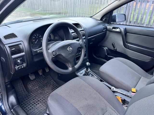 Синій Опель Астра, об'ємом двигуна 1.4 л та пробігом 250 тис. км за 2476 $, фото 5 на Automoto.ua