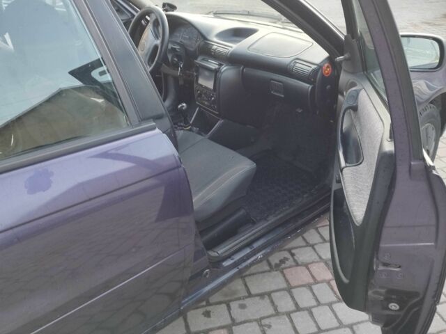 Синий Опель Астра, объемом двигателя 1.7 л и пробегом 308 тыс. км за 2150 $, фото 8 на Automoto.ua