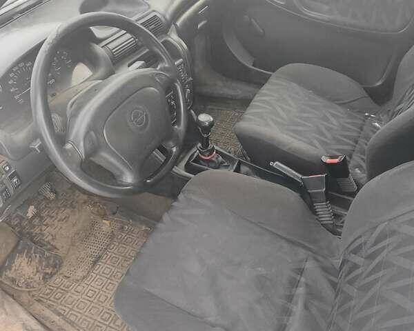 Синий Опель Астра, объемом двигателя 1.6 л и пробегом 290 тыс. км за 1500 $, фото 3 на Automoto.ua