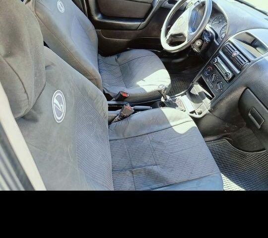 Синий Опель Астра, объемом двигателя 2 л и пробегом 250 тыс. км за 1100 $, фото 2 на Automoto.ua