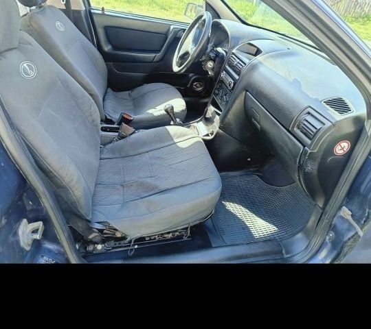 Синий Опель Астра, объемом двигателя 2 л и пробегом 250 тыс. км за 1100 $, фото 1 на Automoto.ua