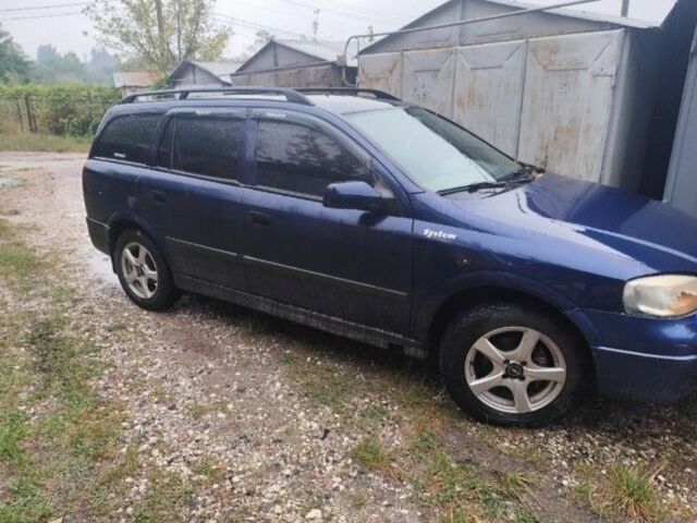 Синий Опель Астра, объемом двигателя 2 л и пробегом 240 тыс. км за 639 $, фото 1 на Automoto.ua