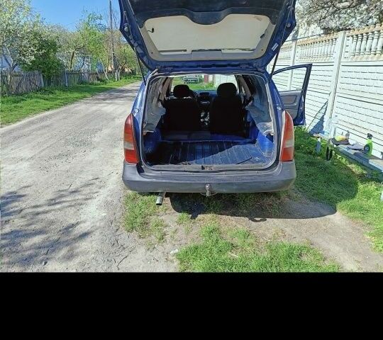 Синий Опель Астра, объемом двигателя 2 л и пробегом 250 тыс. км за 1100 $, фото 4 на Automoto.ua