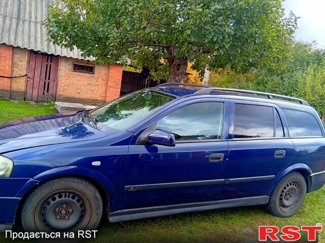 Синий Опель Астра, объемом двигателя 2 л и пробегом 245 тыс. км за 3200 $, фото 1 на Automoto.ua