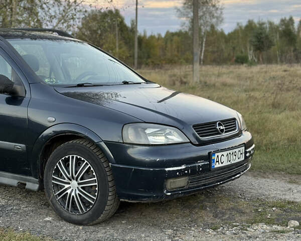 Синий Опель Астра, объемом двигателя 2 л и пробегом 250 тыс. км за 2350 $, фото 1 на Automoto.ua